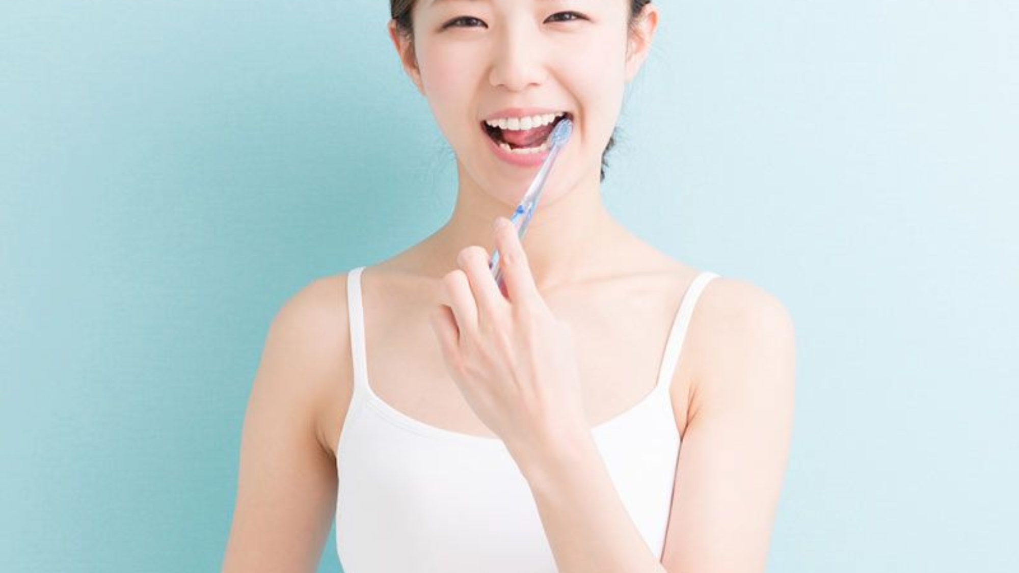 Woman Brushing Teeth